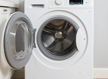 Technician carefully repairing a modern refrigerator in a bright kitchen.