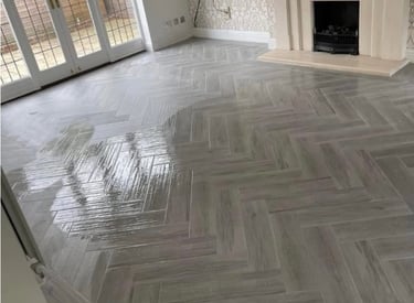 Herringbone grey floor tiling by Roman Refurbs in Cheshunt tiling experts in UK