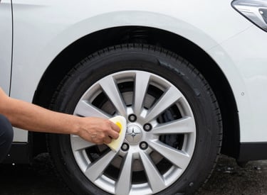 Close-up of a car being polished by a professional with a soft cloth
