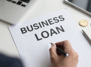An entrepreneur reviewing plans in a bright office filled with natural light.