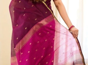 Woman from behind wearing a purple chanderi silk saree with gold zari border and floral motifs.
