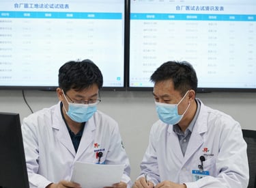 Modern laboratory setting with scientists collaborating over biomarker data on computer screens.