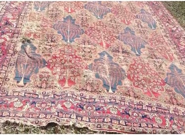 Restored antique rug after professional repair and full reconstruction.