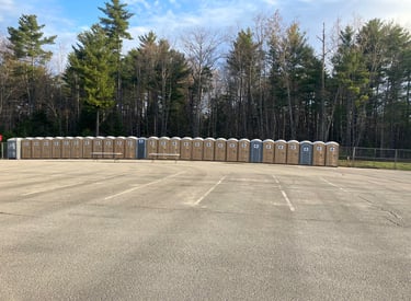 portable potties in a parking lot