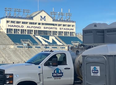 Truck at u of Maine with portable toilets
