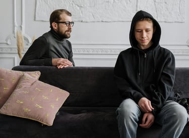 a man and woman sitting on a couch