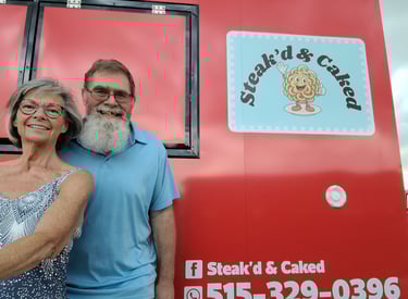 This is an image of Cindy and Rodney Niemier who are the current owners of Steak'd & Caked mobile food trailer