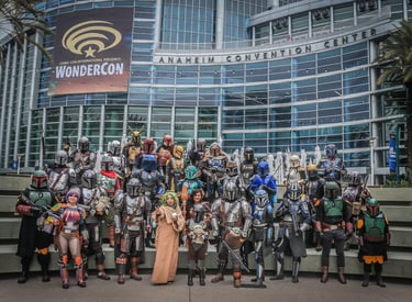 Star Wars Mandalorian cosplayers posing at WonderCon outside the Anaheim Convention Center.