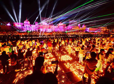 Crowds celebrate Diwali with a vibrant laser light show and thousands of oil lamps at an Indian temple.