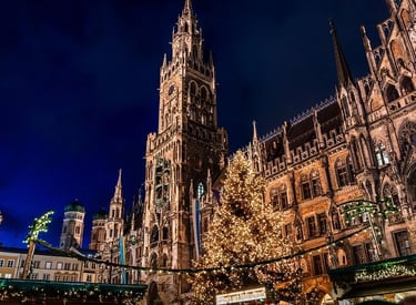 Marienplatz in Munich, Germany, showcases a magnificent Christmas tree adorned with festive lights and charming market