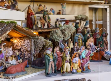 Detailed traditional Christmas nativity scene figurines including Baby Jesus in a stable and the Three Wise Men.