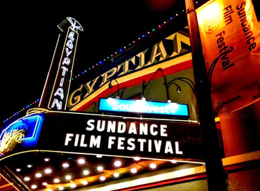 Illuminated Egyptian Theatre marquee hosting the Sundance Film Festival at night in Park City.