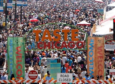 A massive crowd gathers at the Taste of Chicago food festival entrance in Grant Park.