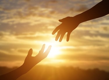 Image of two hands reaching out for each other