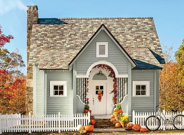Image of home with white picket fence