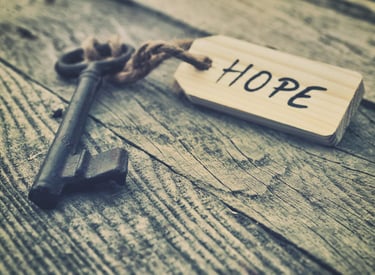 Image of a key with the a tag that reads HOPE
