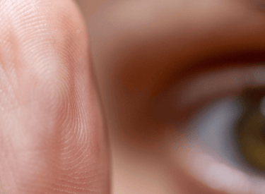 EMDR technique with eye processing movement a person's fingernails on a finger