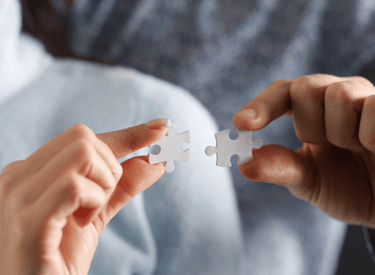 nlp as two persons holding a puzzle piece of puzzle pieces to fit together