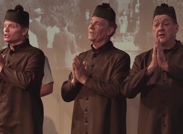 Three priest characters with hands in prayer. 