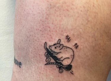 a tattoo of a mouse on the side of a person's leg made at Inari Tattoo