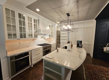 a kitchen with a marble counter top and a large island