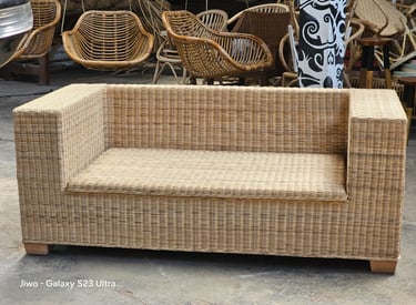 a wicker couch with wicker furniture