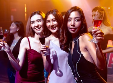 Group of women enjoying drinks at a Las Vegas nightclub during a club crawl event.