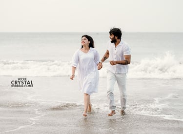 Couples in white costumes on beach for pre wedding photography in kerala