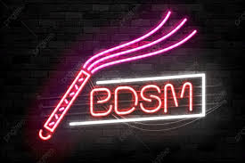 a neon sign featuring whip and letters BDSM