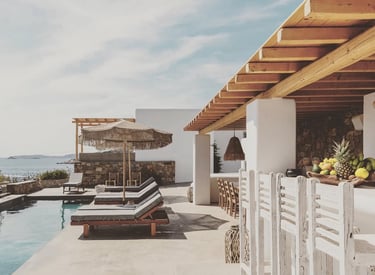 a pool with lounge chairs and a bar