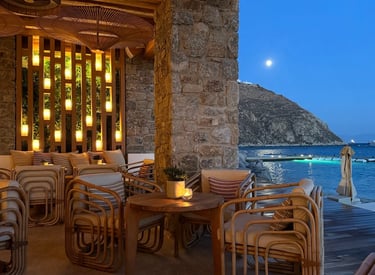 a table with chairs and a table with candles