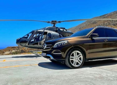 a car parked on a runway with a helicopter in the background