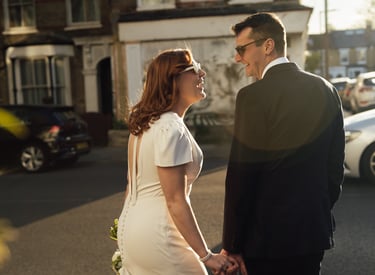 bride smiling and groom during sunset golden hour