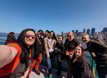 Group of coworkers enjoying the ferry ride to Bainbridge Island with views of downtown Seattle