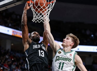 Close-up of a soccer player mid-kick with intense focus during a live match.