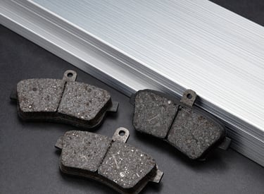 Close-up of stacked colorful technical plastic sheets in an industrial warehouse