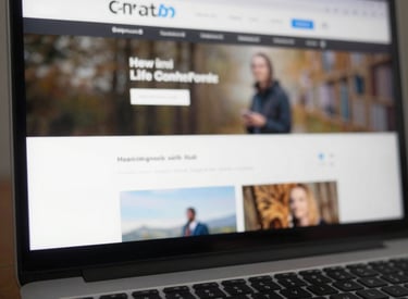 A sleek laptop displaying a minimalist website layout with bright, inviting colors.