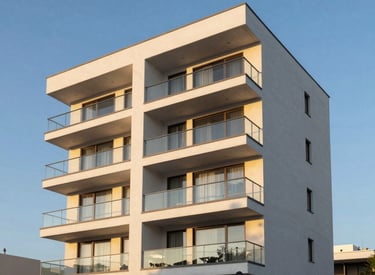 A beautiful shot of a modern South American residential complex with clean lines and large glass balconies, captured during the golden hour to emphasize security and property value, with a clear blue sky, portraying clarity and trustworthiness.