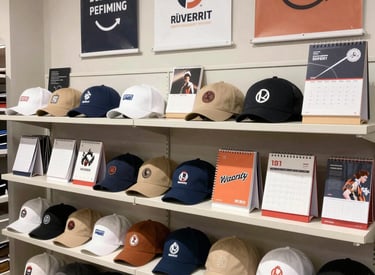 A team collaborating around a laptop, analyzing digital growth charts in a bright modern office.