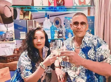 Mark Adam Cottonham and wife toasting in Thailand
