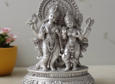 Shimmering silver god idols lined up on a traditional cloth backdrop, ready for pooja.