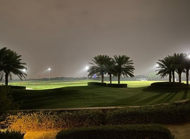 a golf course at night with a view of the course