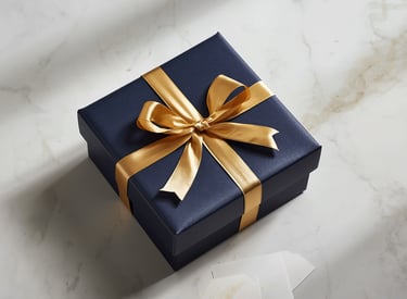 Luxury navy gift box with gold ribbon on marble gift adviser bespoke gift sourcing Milestone Creator