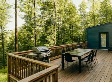 a deck with a table and chairs