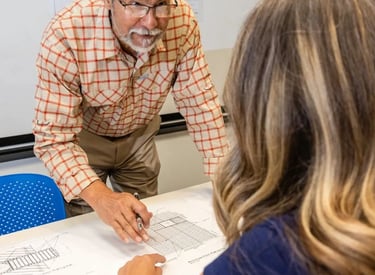 Alberto reviewing project with client