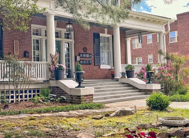 a house with a porch and steps leading up to a porch