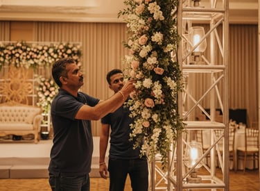 a man planning and decoratiing wedding in front of a stage