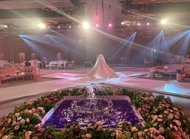 a wedding ceremony with a fountain fountain in the center of the room