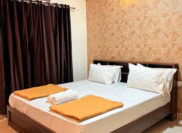a bed with two pillows and a blanket on it