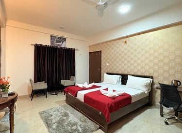 a bedroom with a bed and a desk